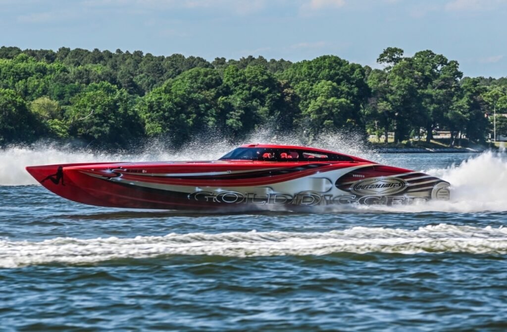 Red offshore catamaran running on a lake
