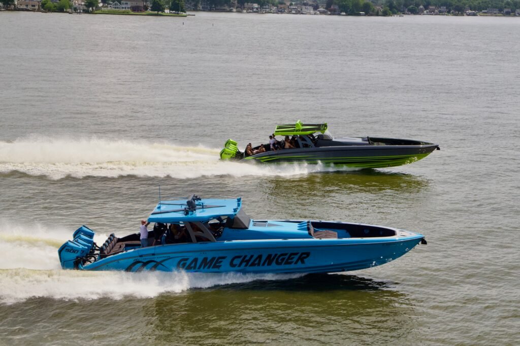 Two Go Fast center consoles running close to shore