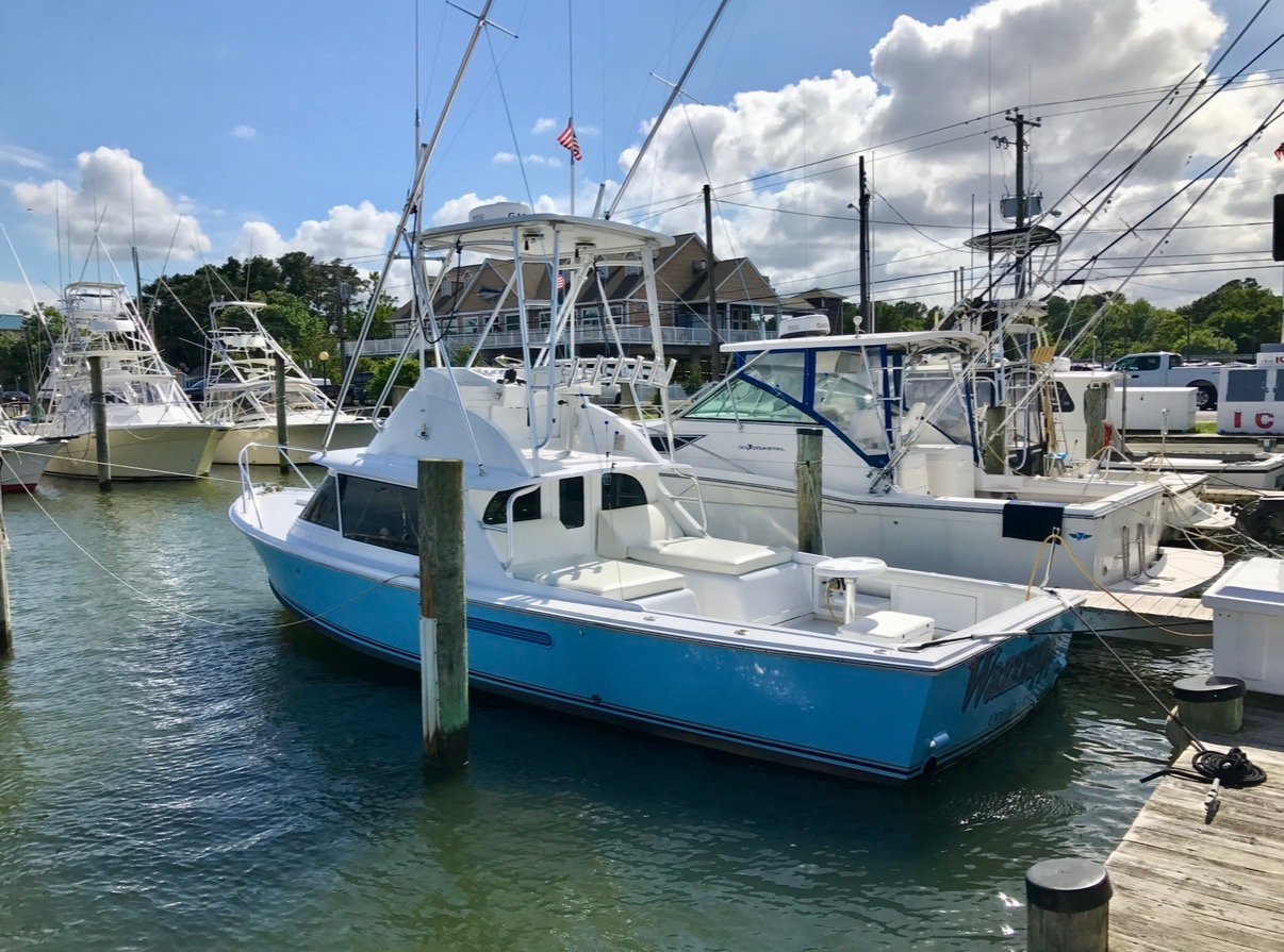 Classic 31 Bertram FBC sitting at the dock ready to head out.