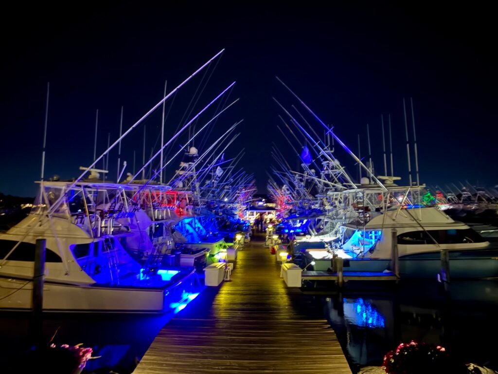 Sportfishing boats lit up in West Ocean City before the White Marlin Open